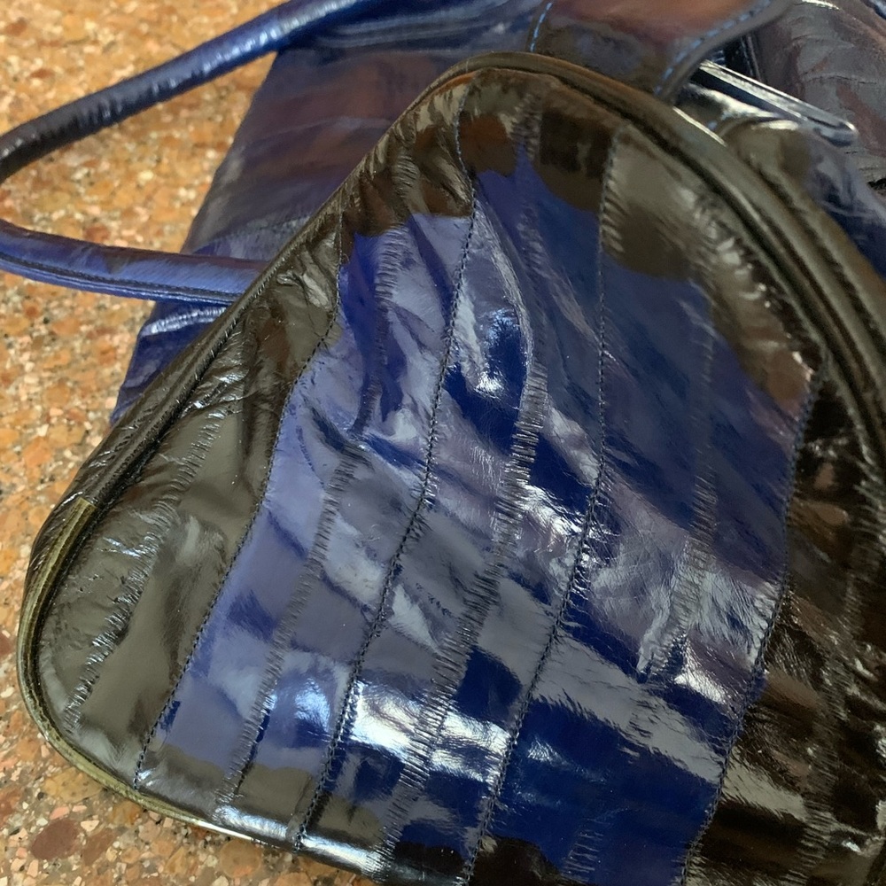 Blue and black with gold snakeskin purse. Never used